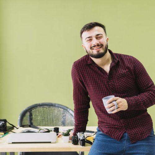 smiling-photographer-drinking-coffee